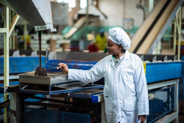 Rose Mugo explaining the process of tea production  at CBES